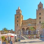 Cefalu, Italy - March 19, 2019: Town square in front of The Cathedral of Cefalu (Duomo di Cefalu), Sicily (Cefalu, Italy - March 19, 2019: Town square in front of The Cathedral of Cefalu